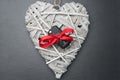 Car key with red bow on a wooden heart Royalty Free Stock Photo