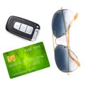 Car key with remote control, sunglasses and credit card, isolated