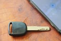 car key and smart phone opened map on table Royalty Free Stock Photo