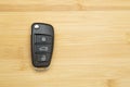 Car key on a wooden background. Production of car keys