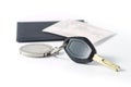 Car keys with insurance paper behind on white Royalty Free Stock Photo