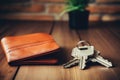 car keys and wallet on the wooden table. copy space. AI Generated Royalty Free Stock Photo