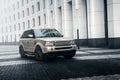 Car Land Rover Range Rover stand near modern building in Moscow city at daytime