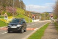 Car leaving level crossing.