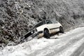 A car lies in a snowbank