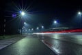 Car light trail and city light. Night shot. Vehicle back lights illumination on highway