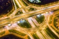 Car light trails in the city road intersection at night. roundabout aerial view