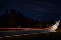 Car light trails on the road at night. Long exposure photo.