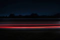 Car light trails on the road at night. Long exposure photo.