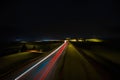 Car light trails on the road at night. Long exposure photo.