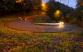 Car lights on a curve at night in the city Royalty Free Stock Photo