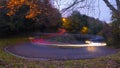 Car lights on a curve at night in the city Royalty Free Stock Photo