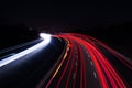 Car lights on highway with a dark night