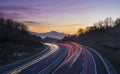 Car lights at night on the road going to the city of Donostia Royalty Free Stock Photo