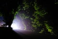 Car lights at night on the road. Traffic safety in the dark. Light at the end of the tunnel. Selective focus Royalty Free Stock Photo