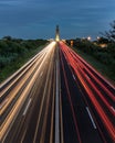 Car lights streaking down a highway at night. Traffic flowing in both directions down the Wantagh Parkway at Jones Beach New York Royalty Free Stock Photo