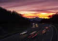 Car lights at sunset driving at high speed on the highway, San Sebastian Royalty Free Stock Photo