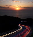 Car lights with sunset and sea Royalty Free Stock Photo