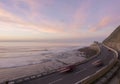 Car lights at sunset by the sea, Zumaia Royalty Free Stock Photo