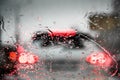 Car lights through the wet windshield Royalty Free Stock Photo