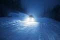 Car lights in winter forest Royalty Free Stock Photo