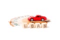 Car loan, saving money for a car or material design concepts. Red car on euro banknotes. Money for car loan payment on white backg