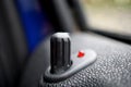 Car locking stick in older passenger car providing the lock of the vehicle as a symbol of security, safety, precaution and prot Royalty Free Stock Photo