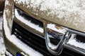 Car logo DACIA covered with snow close up. Snow on Dacia Duster in Bucharest, Romania, 2021 Royalty Free Stock Photo