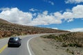 Car on a long road to the sky horizon Royalty Free Stock Photo