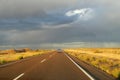 Car on a long road to the sky horizon Royalty Free Stock Photo