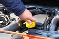 Car maintenance concept. Driver checking oil level in car engine. Cars and transportation, hand close up Royalty Free Stock Photo