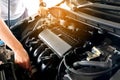 Car maintenance technician He is checking the auto engine, car inspection center