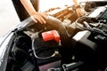 Car maintenance technician He is checking the auto engine, car inspection center