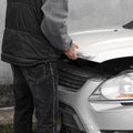 Car master opened the hood. Man opens car bonnet for engine inspection