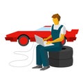 Car mechanic adjusts sportcar with laptop. Service station worker