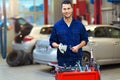 Car mechanic in auto repair shop Royalty Free Stock Photo