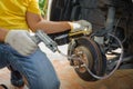 Car mechanic bleed air out of brake system Royalty Free Stock Photo