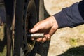 Car mechanic changing car wheel and tire by wrench at car garage in Bucharest, Romania, 2021 Royalty Free Stock Photo