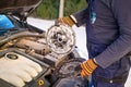 Car mechanic is changing clutch. Royalty Free Stock Photo