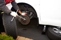 Car mechanic changing tire. Royalty Free Stock Photo