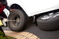 Car mechanic changing tire. Royalty Free Stock Photo