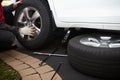 Car mechanic changing tire. Royalty Free Stock Photo