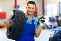 Car mechanic changing tires Royalty Free Stock Photo