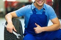 Car mechanic changing tires Royalty Free Stock Photo