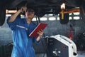 Car mechanic checking and having car transmition maintenance service at garage and service station