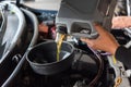 Car mechanic fills a fresh lubricant engine oil Royalty Free Stock Photo