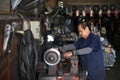 Car mechanic fixing disc brake by machine