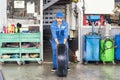 Car mechanic fixing truck tires. The tires are going to change the car. Mechanic changing a wheel of a car Royalty Free Stock Photo