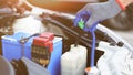 Car mechanic hand is opening the radiator cap to check the coolant level of the car radiator. Check Car radiator, car yourself, Royalty Free Stock Photo