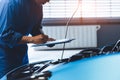 Car mechanic holding clipboard and checking to maintenance vehicle by customer claim order in auto repair shop garage. Engine Royalty Free Stock Photo